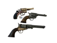 Three replica revolvers.