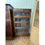 Early 20th Century mahogany four height leaded glazed door bookcase with base drawer, 166.5cm by 86.