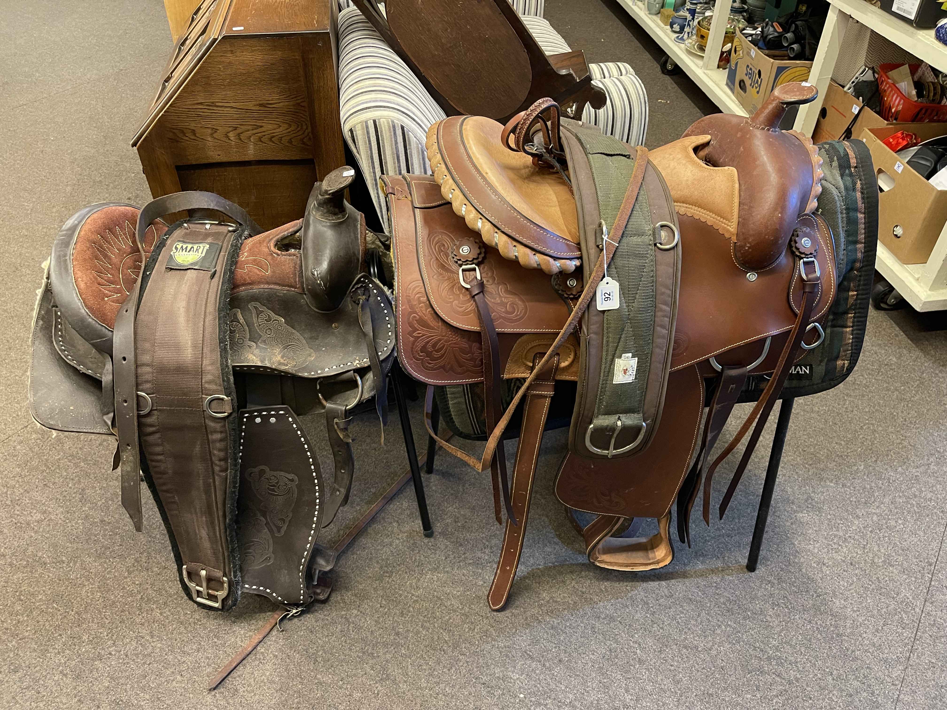 Two Western saddles with accessories.