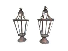 Pair of ornate metal and glazed hall hanging lanterns.
