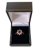 Ruby and diamond nine stone 18 carat gold cluster ring, size M.