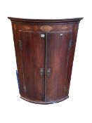 Inlaid mahogany two door bow front corner wall cabinet 108cm.