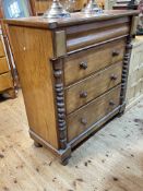 Victorian mahogany chest of four long drawers with ½ twist pillars and bun feet,