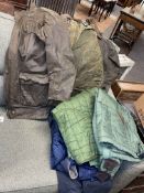 Three wax jackets, Barbour, Belstaff and other coats.