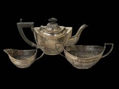 Silver three piece part fluted tea set, Birmingham 1915.