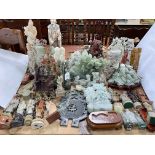 Large collection of soapstone, jade coloured and other carvings.