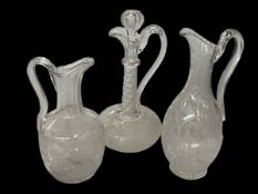 Three vine engraved wine jugs and decanter.