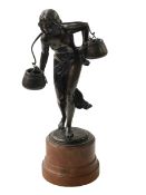 Bronze sculpture of semi-naked female water carrier, 38cm.