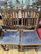 Pair Victorian carved oak hall chairs and Victorian rectangular side table raised on twist pillars