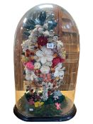 Victorian woollen floral display under glass dome, 66cm high.