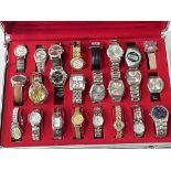 Twenty four various wristwatches in fitted case.