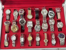 Twenty four various wristwatches in fitted case.