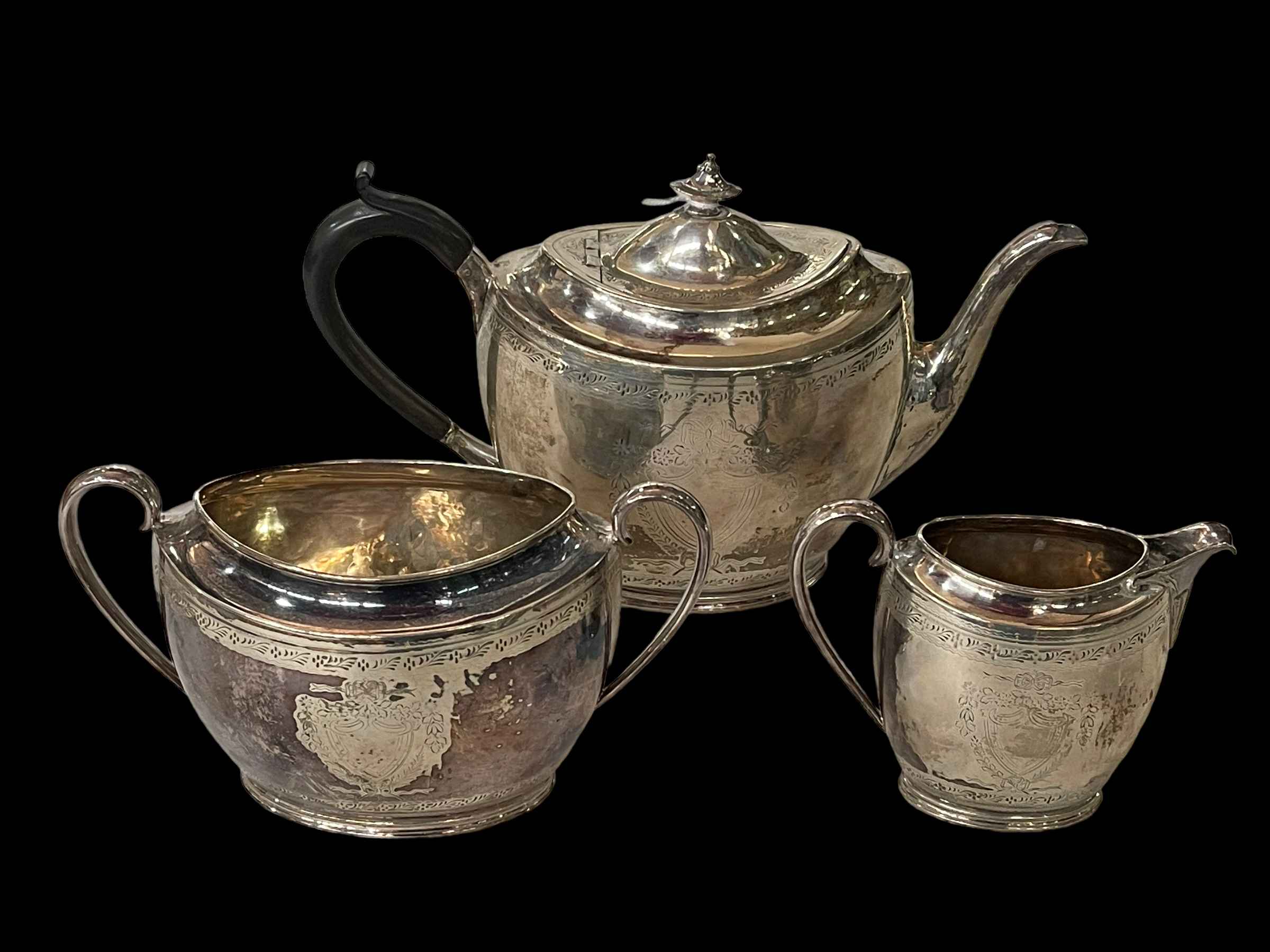 Silver three piece tea set with bright cut and engraved decoration, James Dixon, Sheffield 1892.