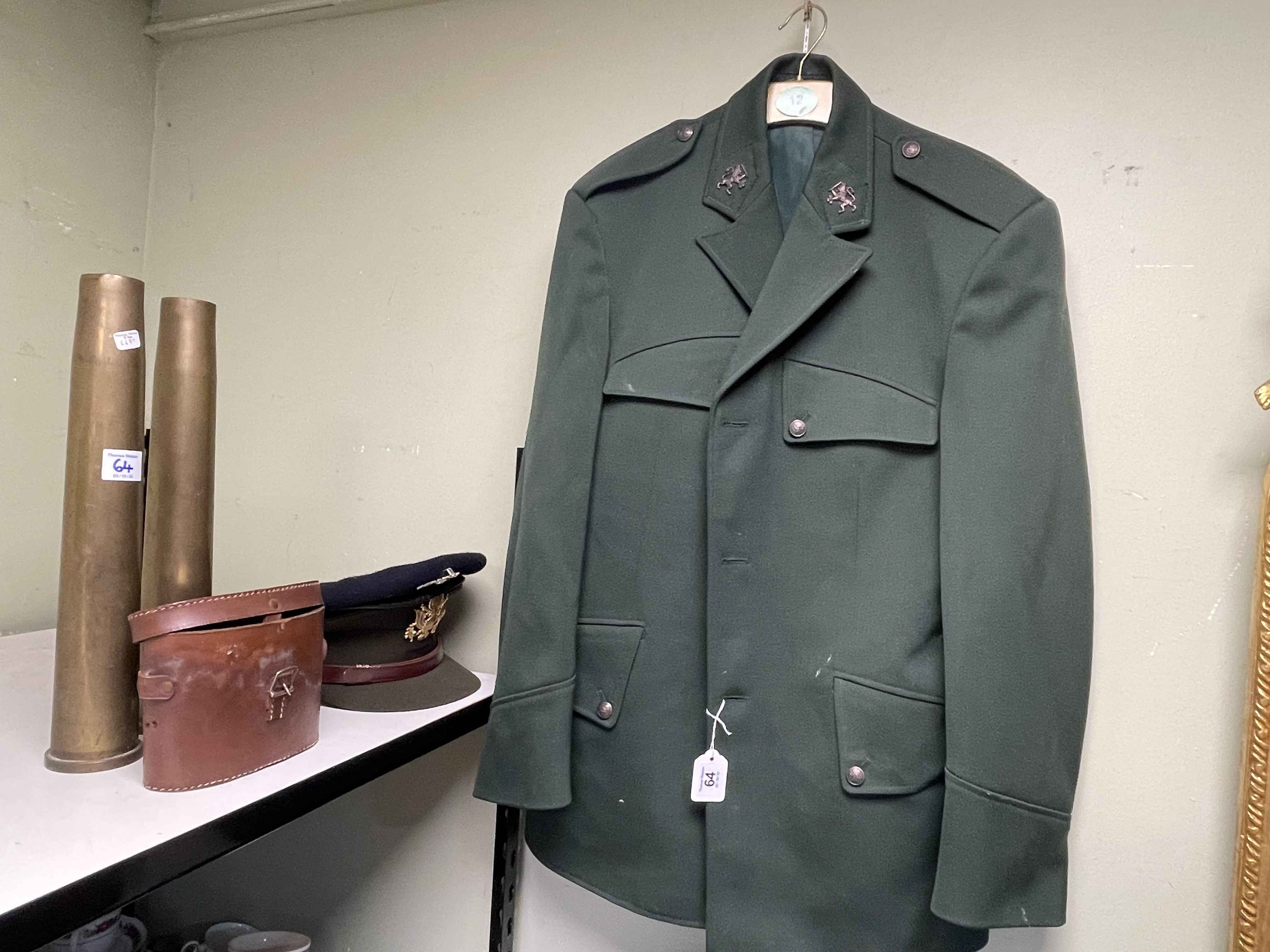Two Military jackets, four belts, two caps, two shell cases and cased binoculars.
