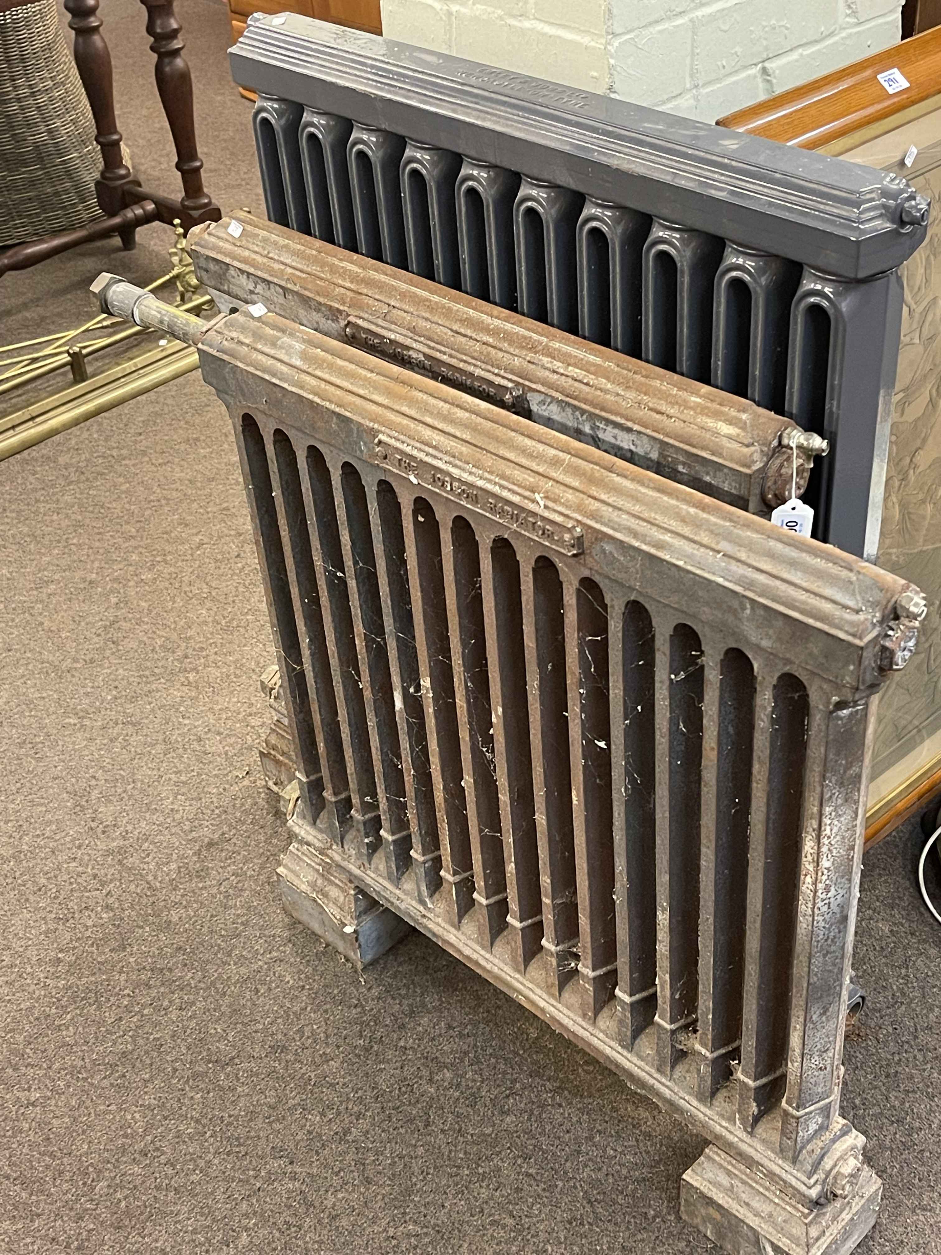 Three vintage cart iron radiators, largest 92cm by 79cm.