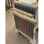 Three vintage cart iron radiators, largest 92cm by 79cm.