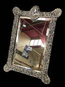 Large Edwardian silver mounted boudoir easel mirror with intricate pierced and embossed scrolls,