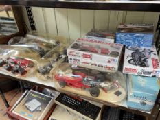 Collection of Formula 1 and other model kits.