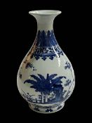 Chinese blue and white baluster vase with ferns and trees, seal mark, 28cm.