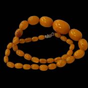 Amber colour bead necklace.