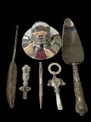 Silver capstan inkwell, silver rattle and handle, silver quill pen and a pencil,