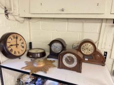 Three arch top mantel clocks, two Bakelite clocks and Sunburst clock.