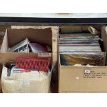 Three boxes of LP and single records.