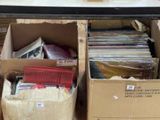 Three boxes of LP and single records.