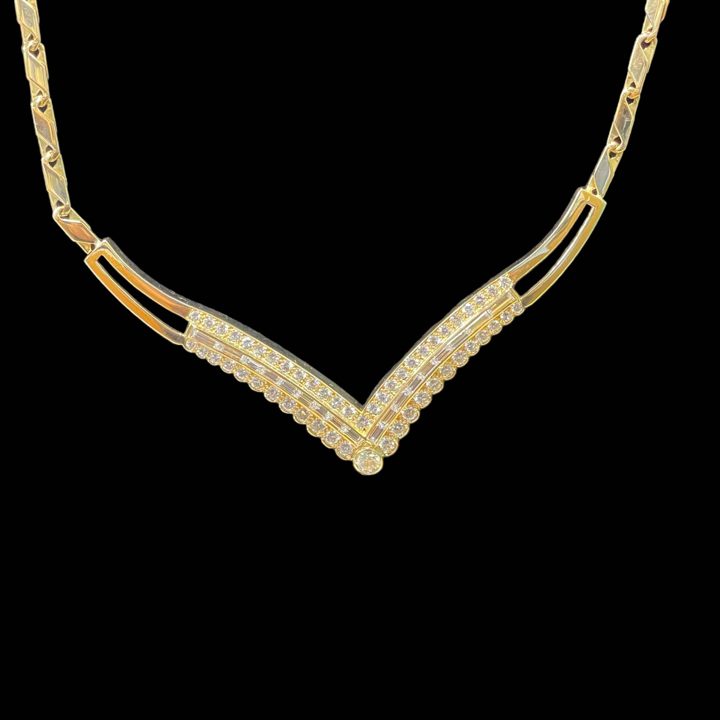 18 carat yellow gold V-shaped diamond pendant necklace to match previous bracelet (Lot 153) with a