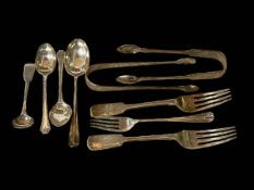 Two pair of silver sugar tongs, four silver spoons and three silver forks.