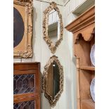 Pair oval gilt framed wall mirrors, 80cm by 35cm.