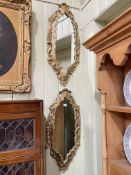 Pair oval gilt framed wall mirrors, 80cm by 35cm.
