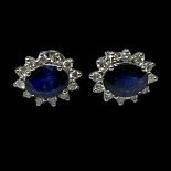 Pair of sapphire and diamond earrings, the central oval sapphires totalling 2.