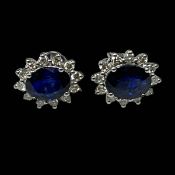 Pair of sapphire and diamond earrings, the central oval sapphires totalling 2.
