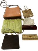 Seven fashion handbags and purses.