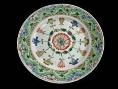 Chinese polychrome plate with stylised decoration, blue mark within two circles, 23cm.