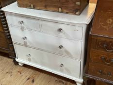 Painted pine chest of two short above two long drawers on turned legs, 86cm by 47cm by 47cm.