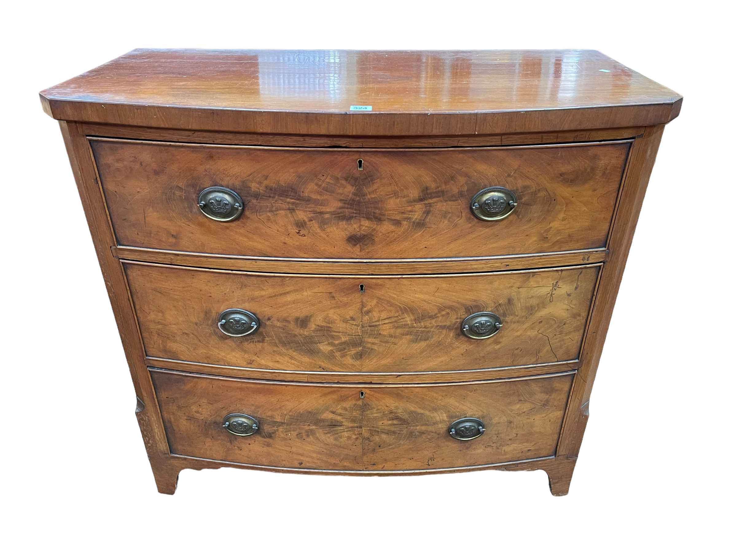 Victorian mahogany bow front chest of three long drawers having canted corners and on bracket feet,