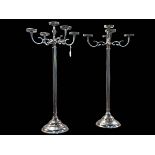 Pair of white metal five branch candelabra, 89cm high.