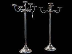 Pair of white metal five branch candelabra, 89cm high.