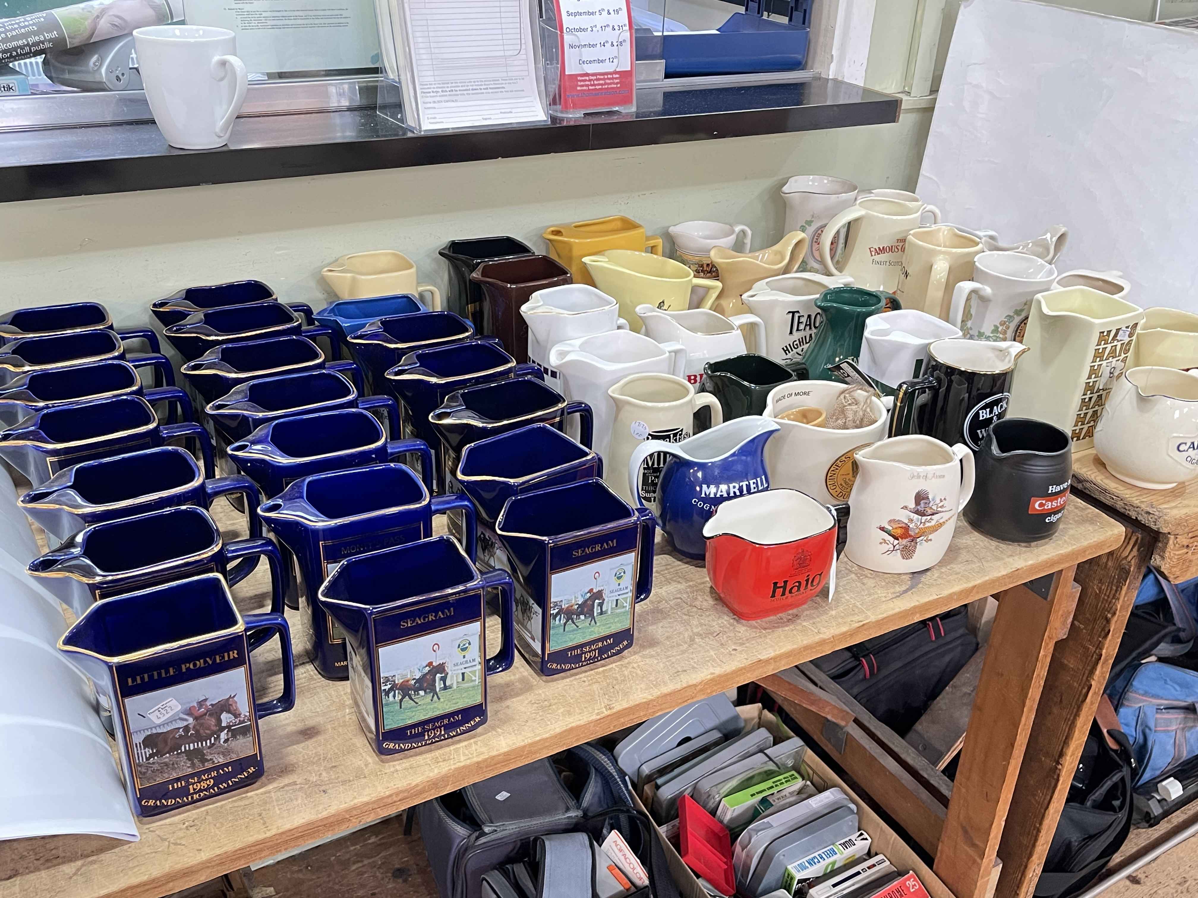 Nineteen Grand National Winner whisky water jugs and collection of whisky water jugs.