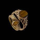 Two 9 carat gold rings, one with tigers eye (5).