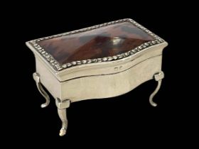 Silver and tortoiseshell serpentine front ring box on cabriole legs, Birmingham 1912, 8cm wide.