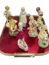 Collection of seven Freda Doughty figurines.