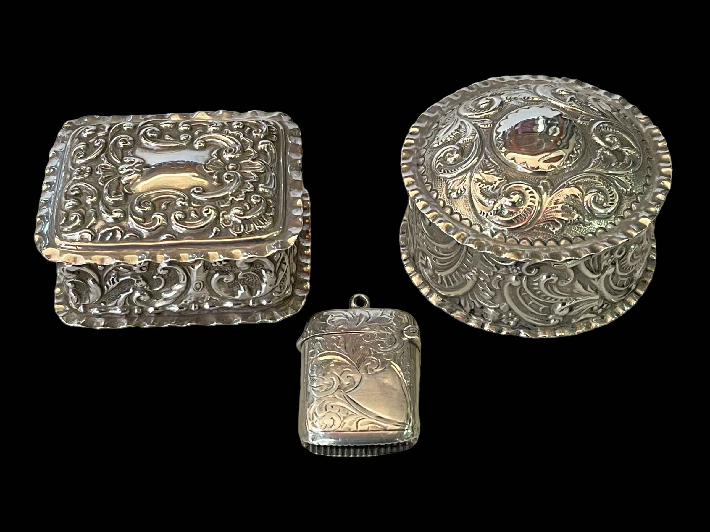 Two small Victorian silver boxes, both Birmingham 1898, and vesta, Birmingham 1903 (3).