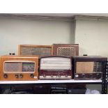 Five vintage radios including Cossar, Marioni, and Philco.