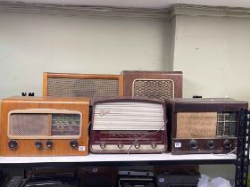 Five vintage radios including Cossar, Marioni, and Philco.