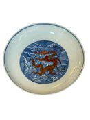 Chinese saucer dish with iron red dragon on blue ground, seal mark, 18cm.
