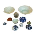 Two Chinese bowls, small tea bowl, opium bottle and assortment of china lids.