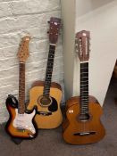 Two Encore acoustic guitars and Pitchmaster electric guitar.